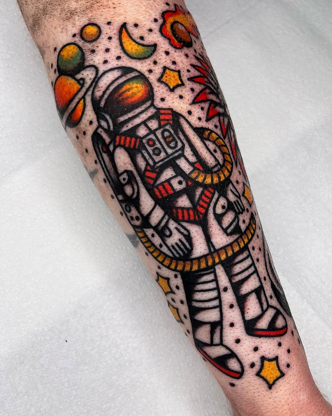 Vibrant astronaut tattoo with cosmic elements Tattoo Design