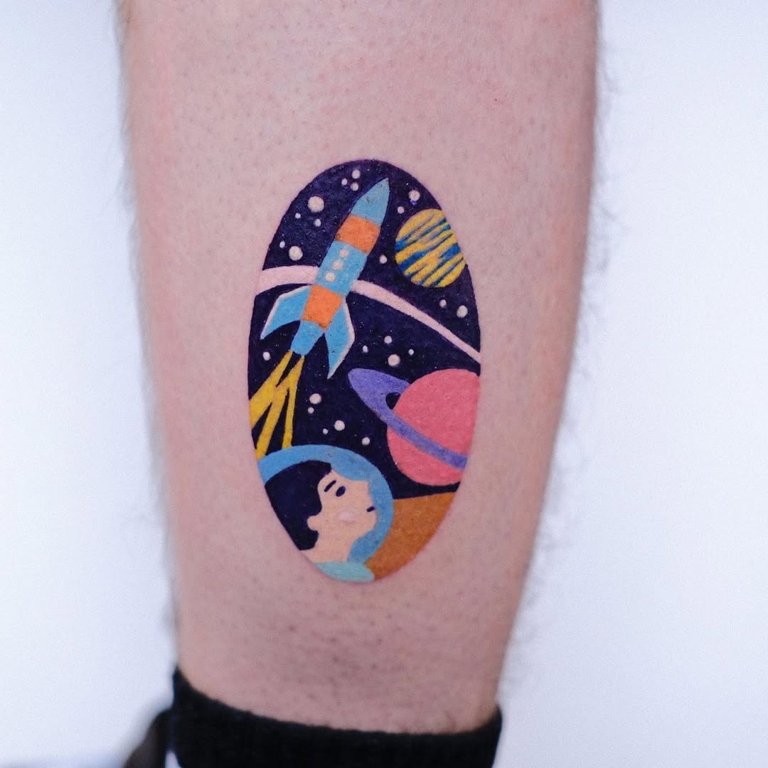 Vibrant space-themed tattoo with astronaut and rocket Tattoo Design