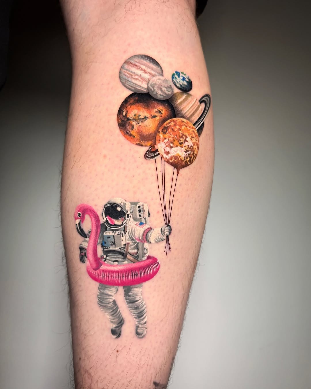 Whimsical astronaut with playful planet balloons Tattoo Design