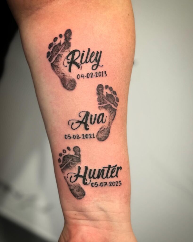Baby Footprints and Name Tattoo on Chest Tattoo Design