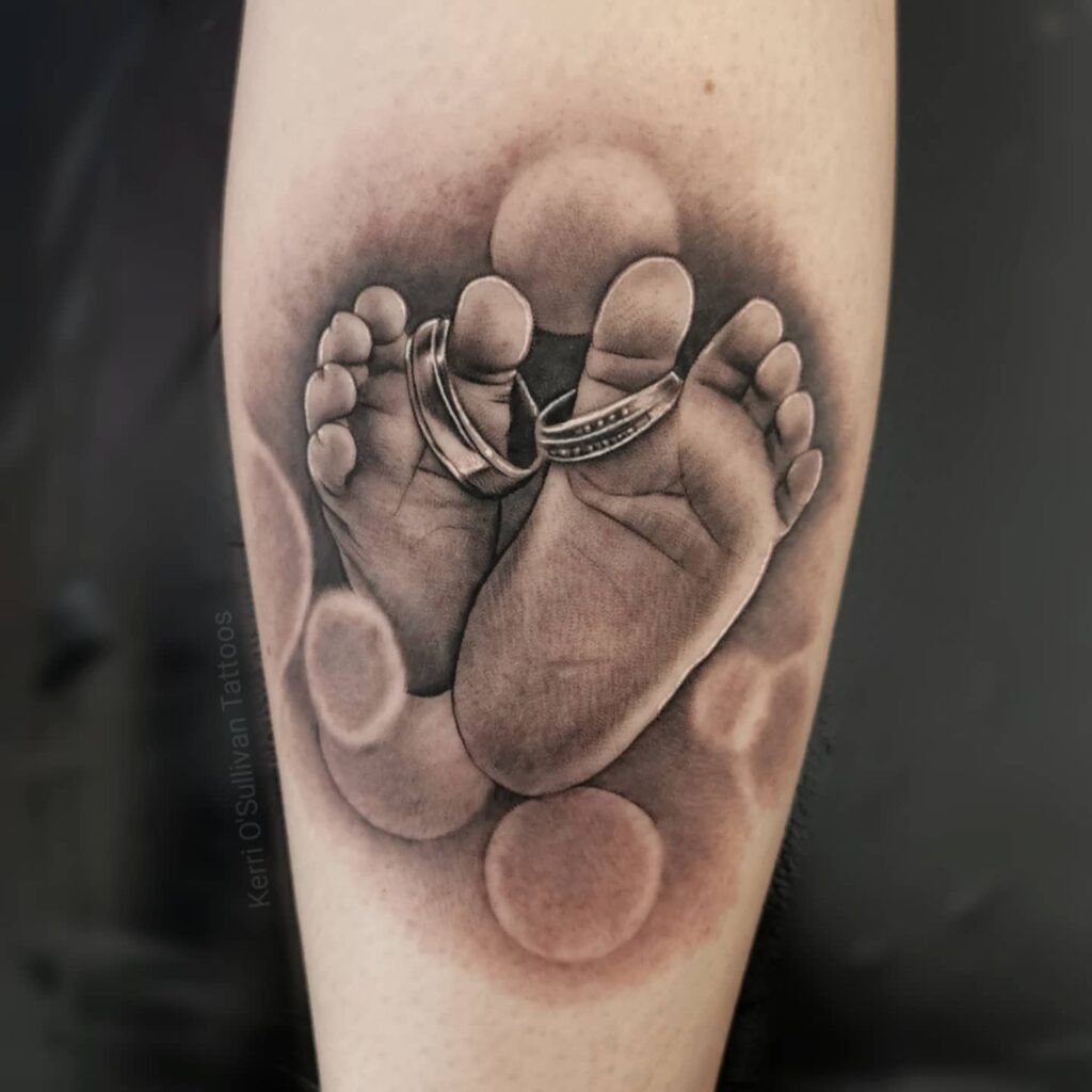 Baby Footprints Tattoo With Colorful Accents Tattoo Design