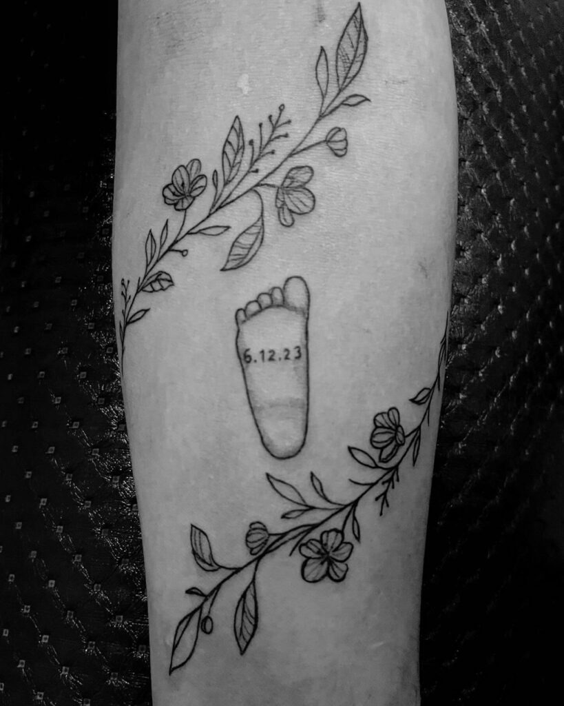 Minimalist Baby Footprints with Roman Numerals Tattoo Tattoo Design