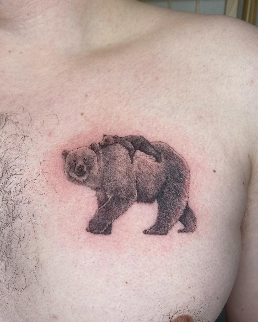 This bear tattoo elegantly captures the essence of wildlife.
