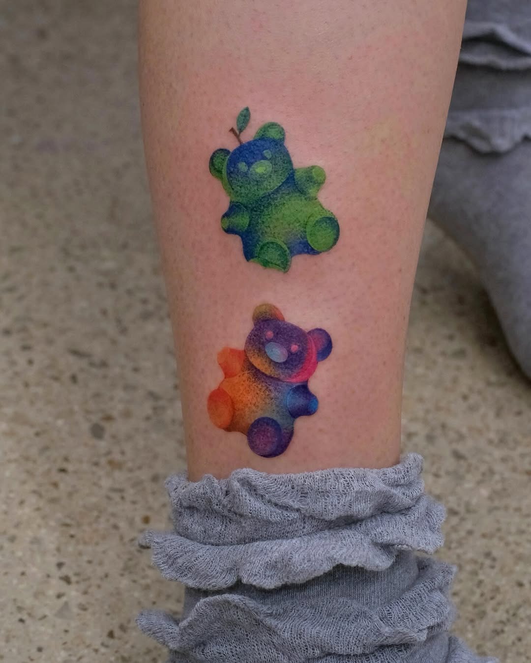 These adorable gummy bear tattoos burst with color, featuring a joyful design that captures a sense of fun.