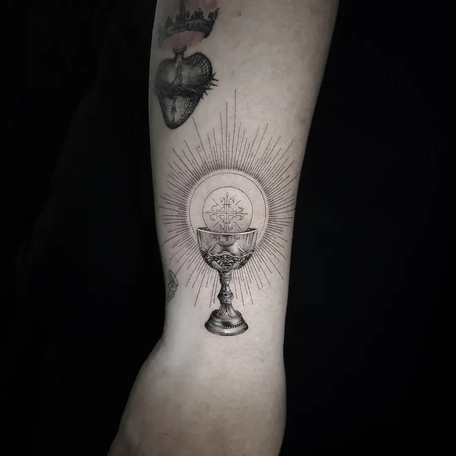 Elegant chalice tattoo with radiant symbolism Tattoo Design