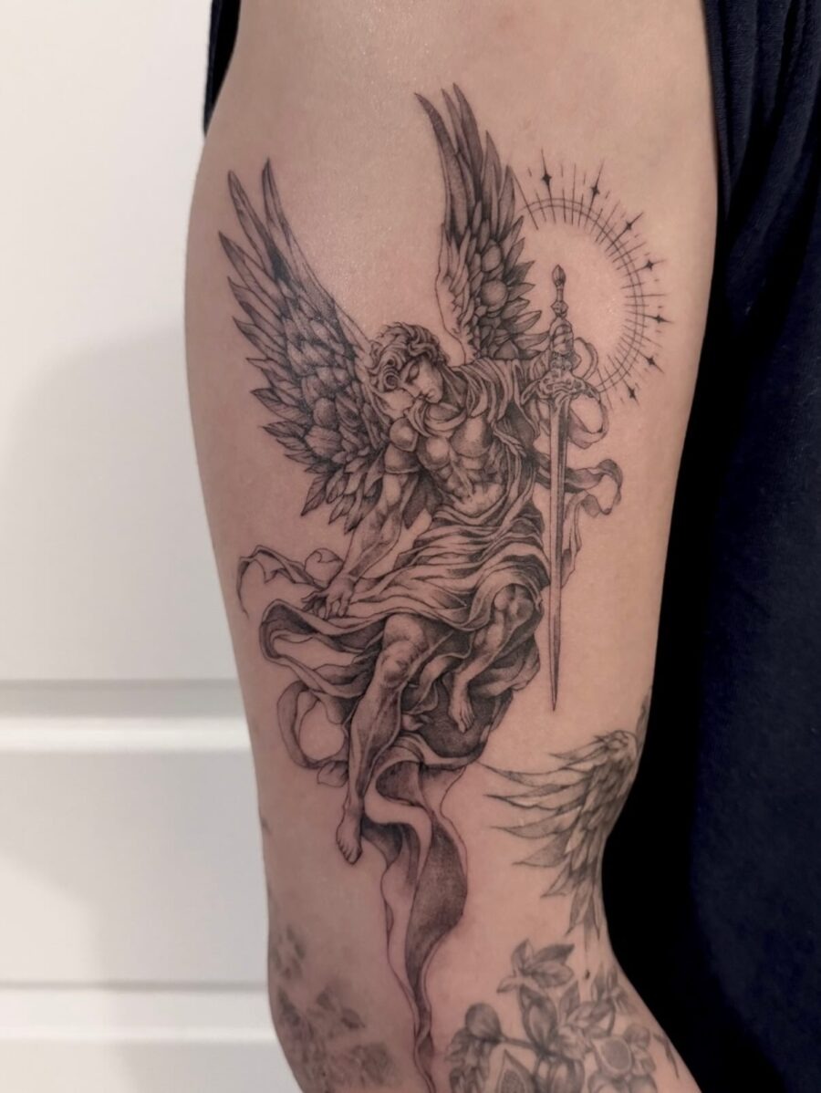 Intricate tattoo featuring wings and an eye Tattoo Design