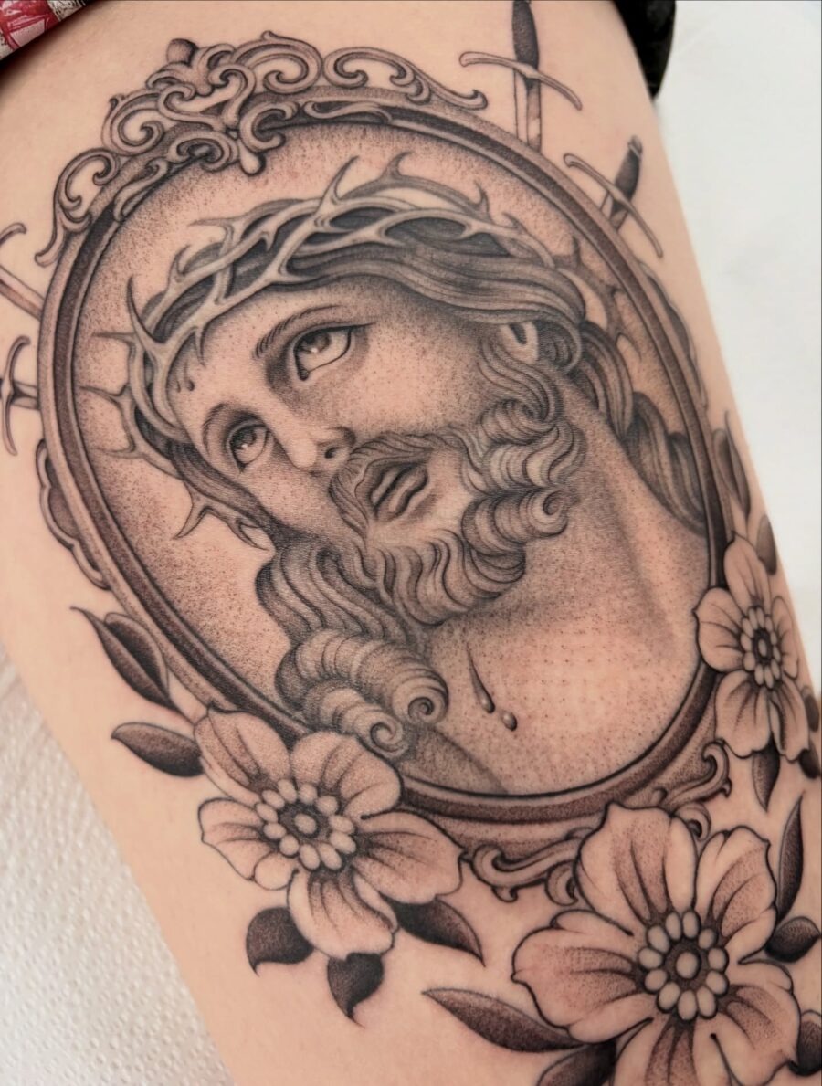 Stunning Jesus portrait with floral elements Tattoo Design