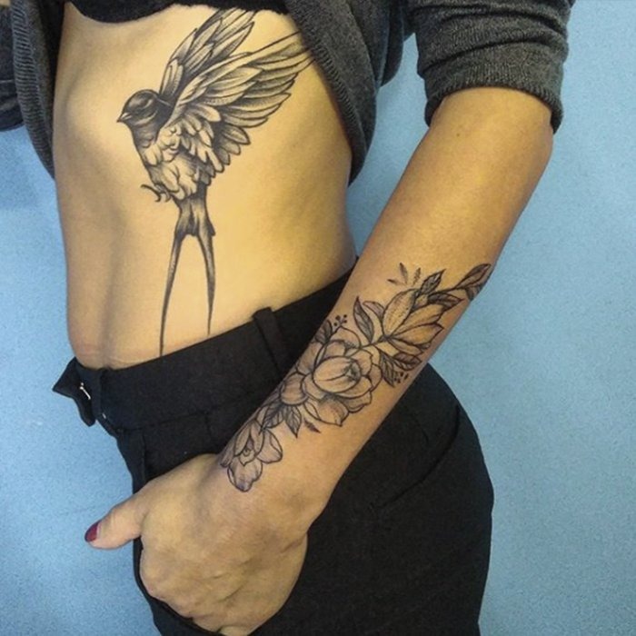 Elegant Grayscale Swallow Tattoo on Ribs Tattoo Design