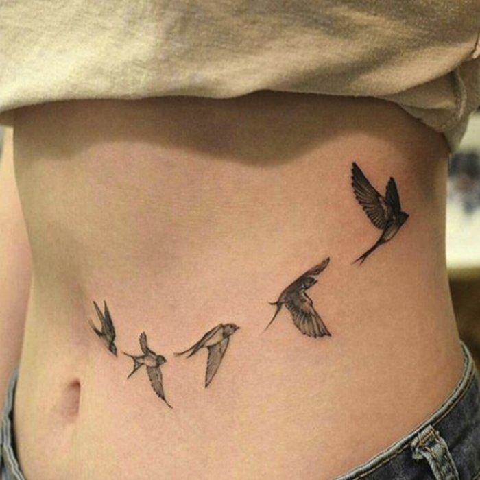 Five Flying Swallows Stomach Tattoo in Grayscale Tattoo Design