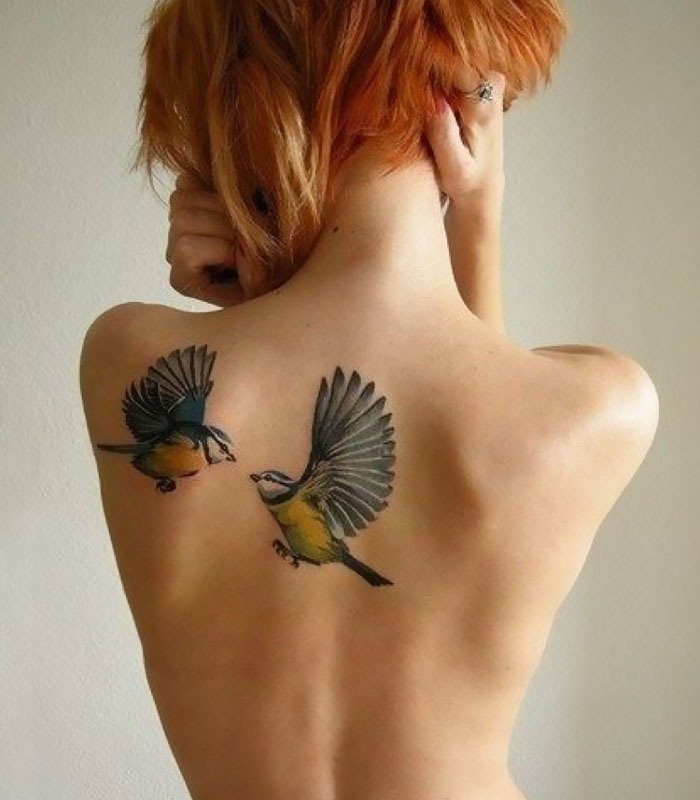Pair of Flying Birds Tattoo on Back Tattoo Design