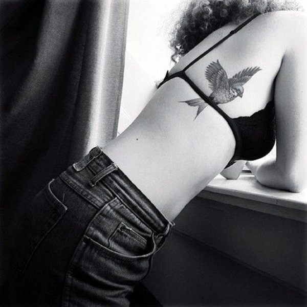 Realistic Grayscale Flying Bird Tattoo on Back Tattoo Design