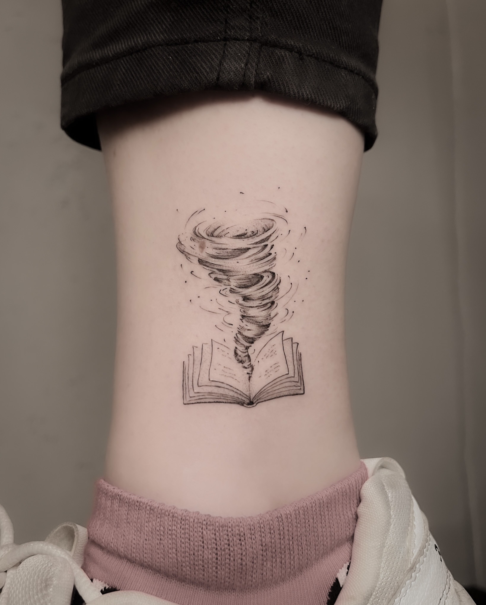 Open Book With Tornado Tattoo Tattoo Design