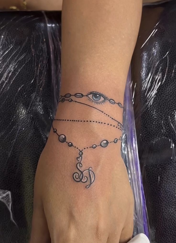 Beaded Bracelet with Eye Symbol Tattoo Design