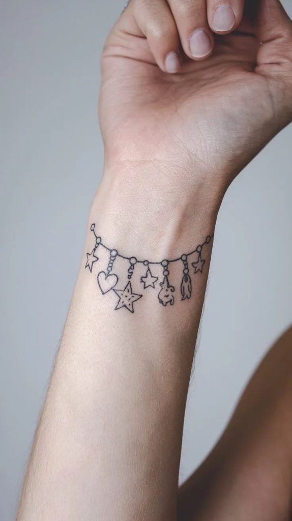 Whimsical Charm Bracelet Tattoo Tattoo Design