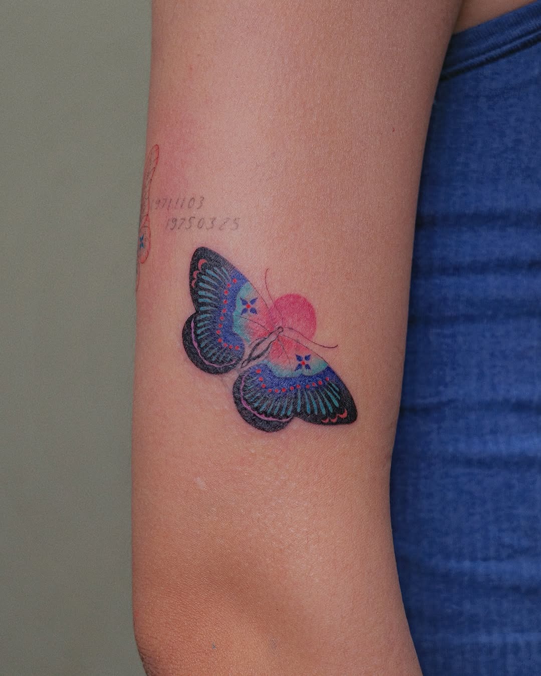 This butterfly tattoo features stunning colors with intricate detailing.