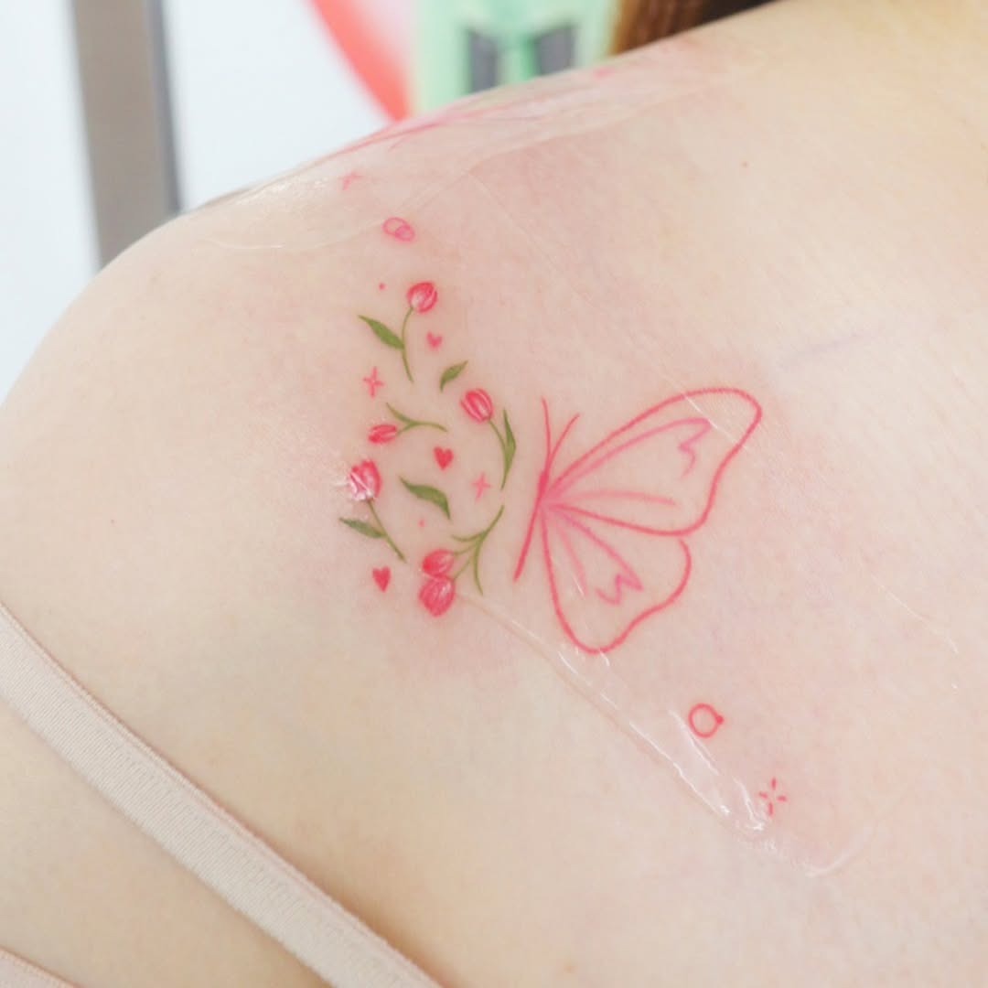 This stunning tattoo features delicate butterflies gracefully placed on the shoulder, intertwined with celestial stars.