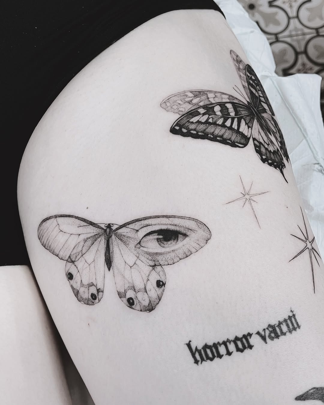 The design centers on realistic butterfly with mystical imagery that reads clearly at a glance.