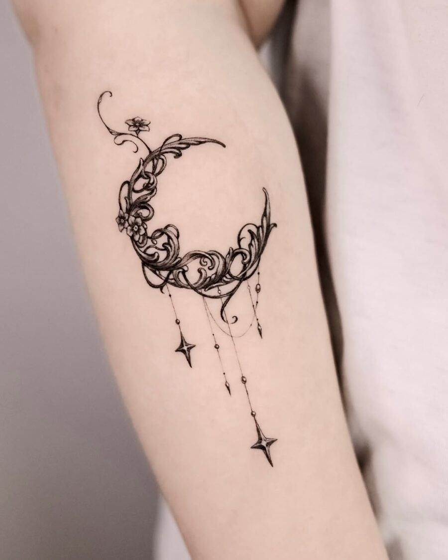 Elegant crescent moon with floral designs tattoo Tattoo Design