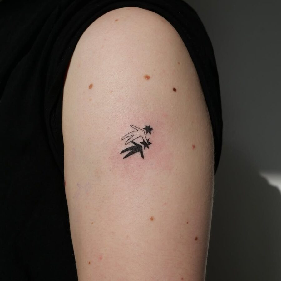 Minimalist celestial star tattoo on arm Tattoo Design