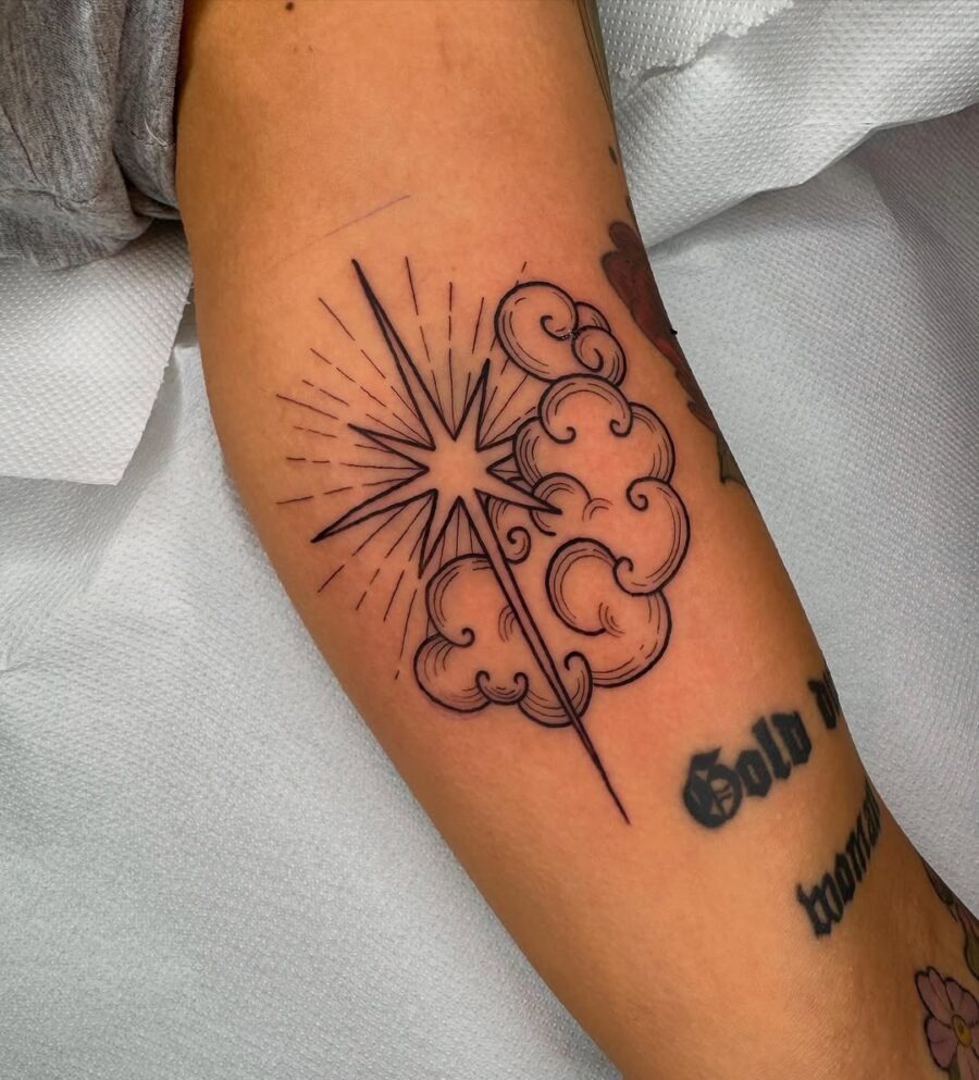 Striking star tattoo with wispy clouds Tattoo Design