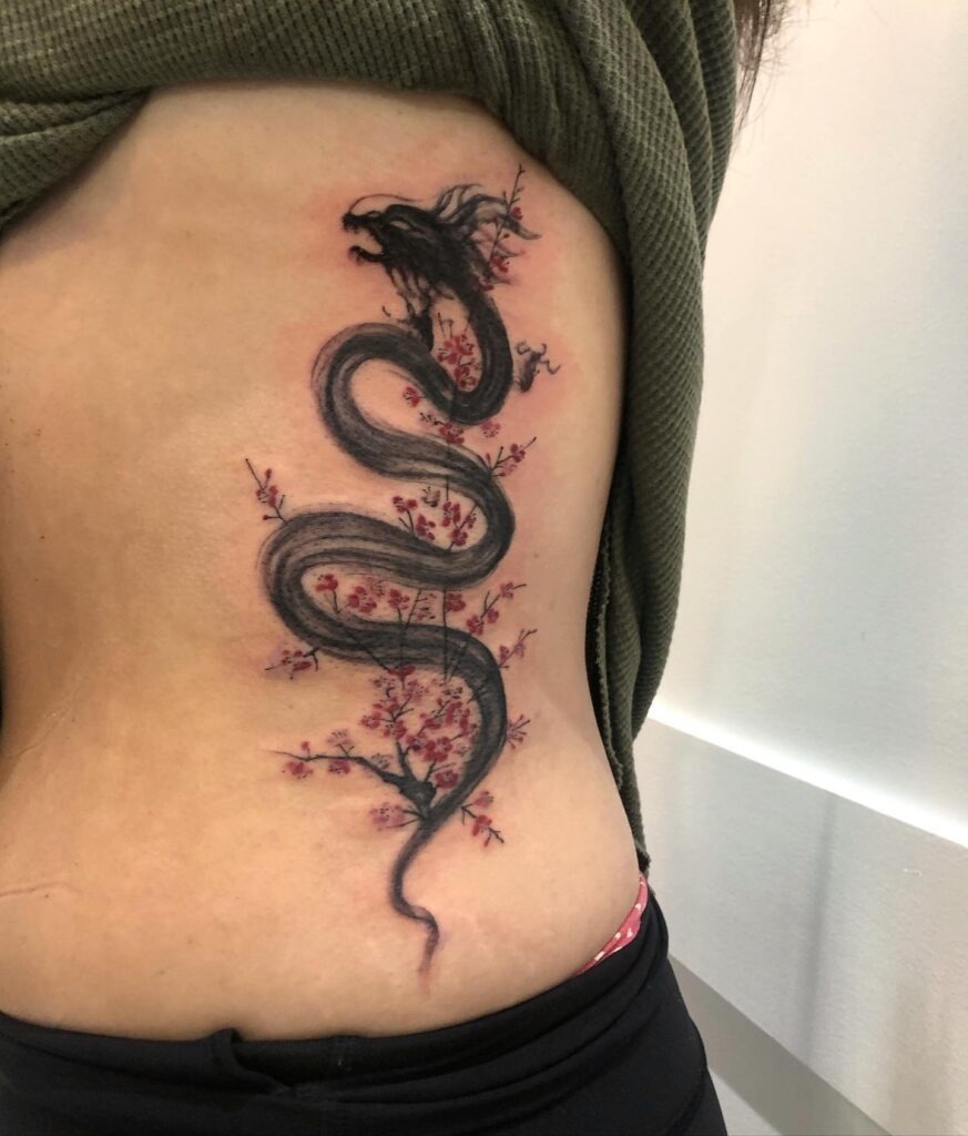 Cherry Blossoms and Black Dragon Rib Tattoo Tattoo Design