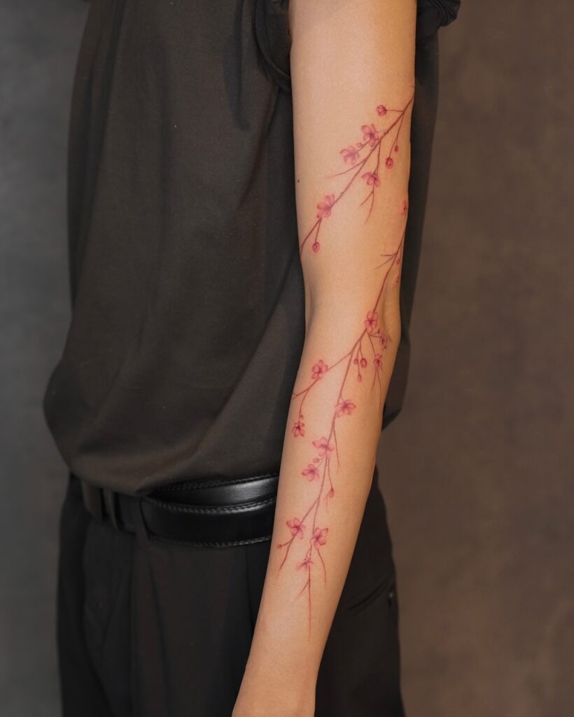 Delicate Cherry Blossom Branch Tattoo on Arm Tattoo Design