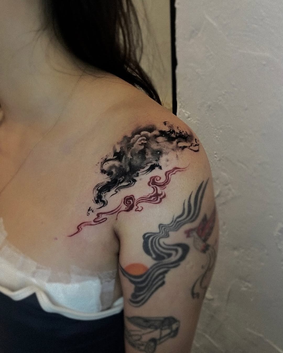 Beautiful shoulder cloud tattoo showcasing artistic flair Tattoo Design