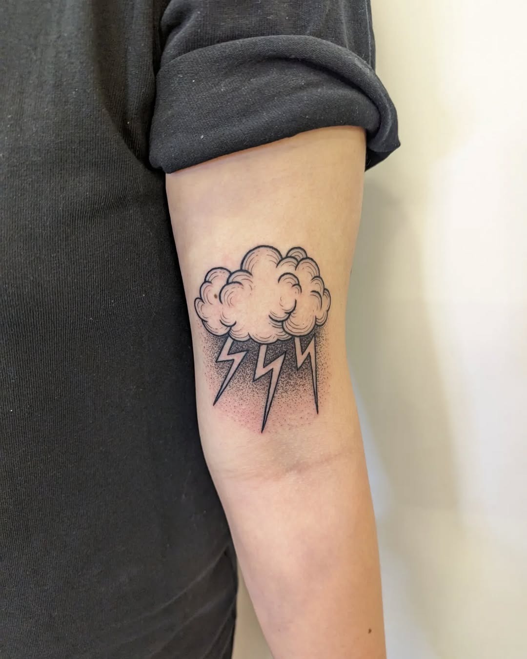 Charming cloud tattoo with lightning elements Tattoo Design