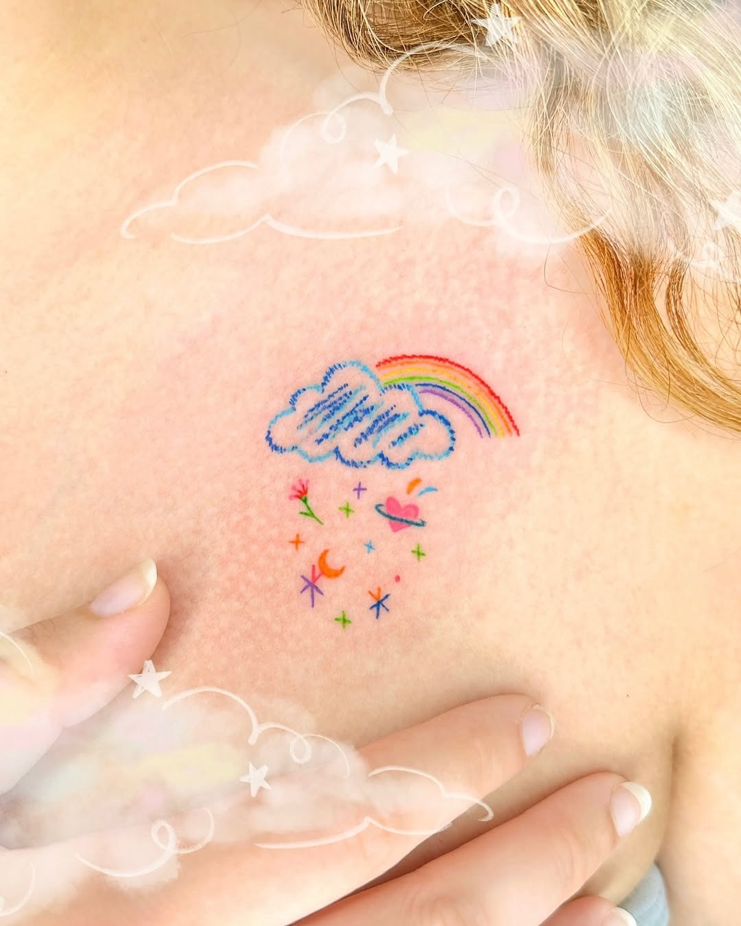 Colorful cloud tattoo with a radiant rainbow Tattoo Design
