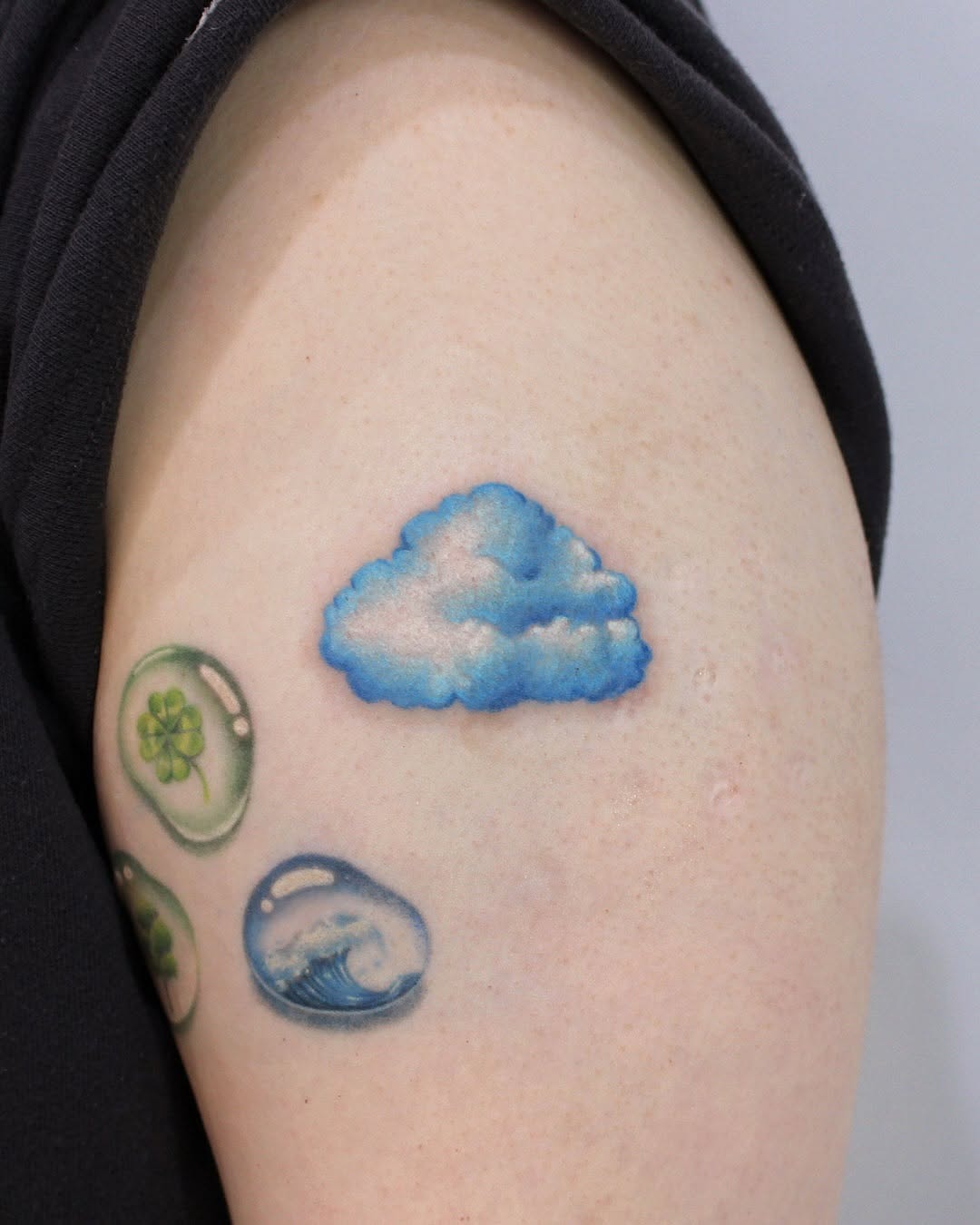 Dreamy Blue Cloud Tattoo on Arm Tattoo Design