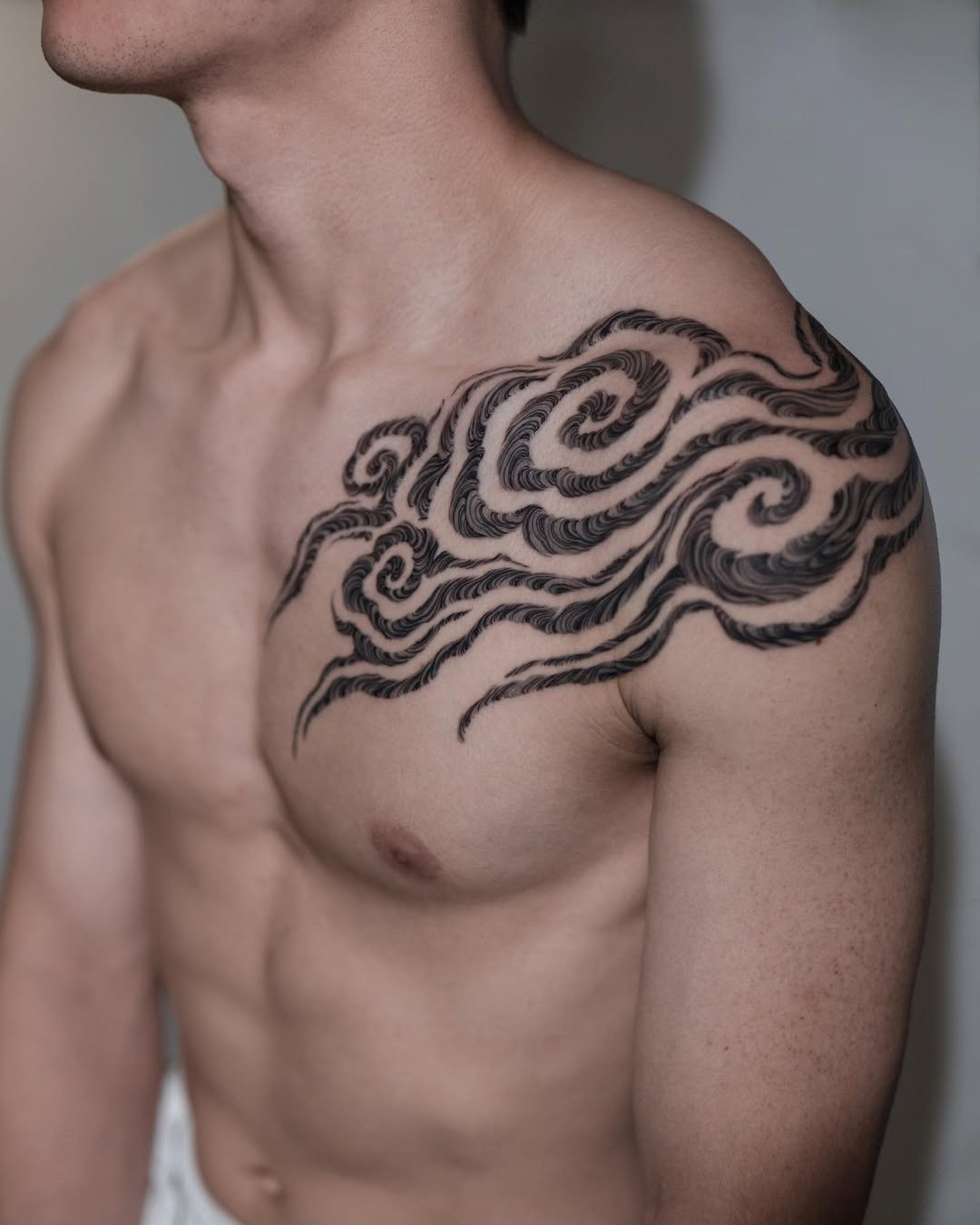 Dynamic cloud tattoo showcasing flowing elegance Tattoo Design