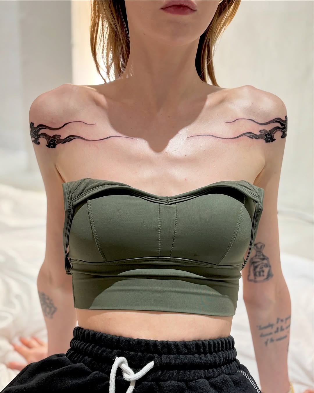 Elegant cloud tattoos gracefully adorn shoulders Tattoo Design