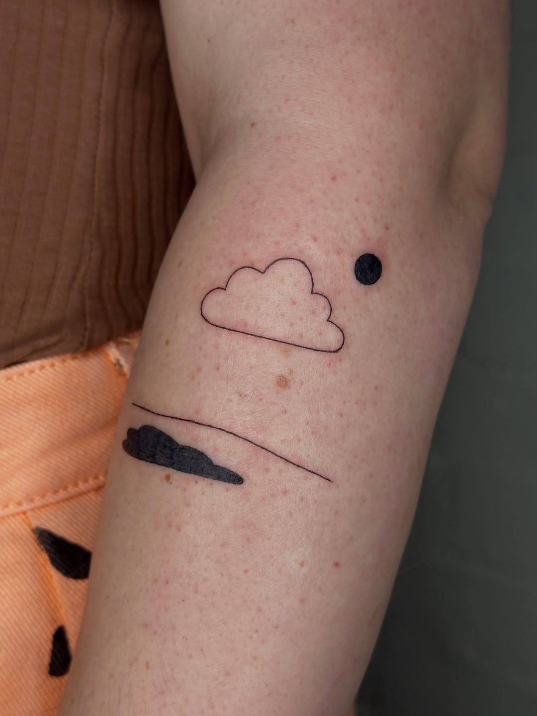 Minimalist cloud tattoo designs on skin Tattoo Design
