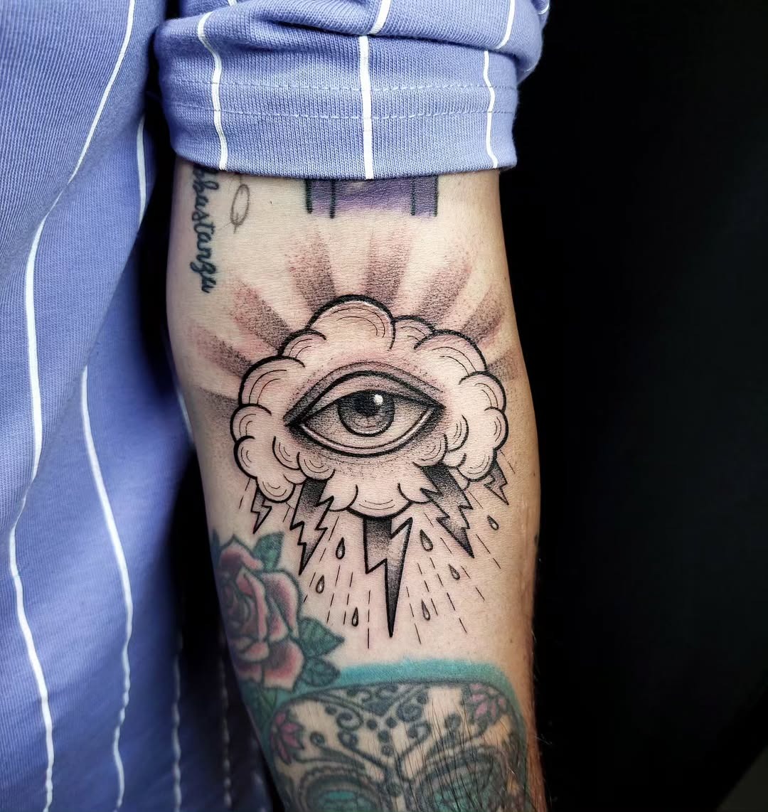 Mystical cloud tattoo featuring an eye Tattoo Design