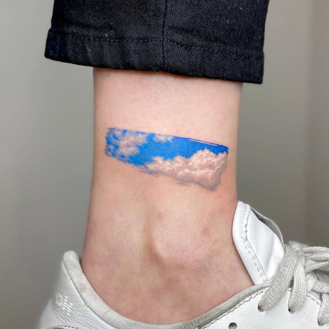 Realistic cloud tattoo on ankle Tattoo Design