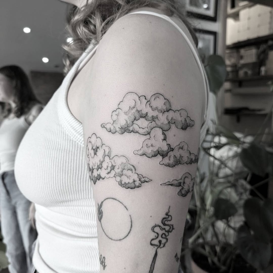 Stylish cloud tattoo perfect for arm placement Tattoo Design