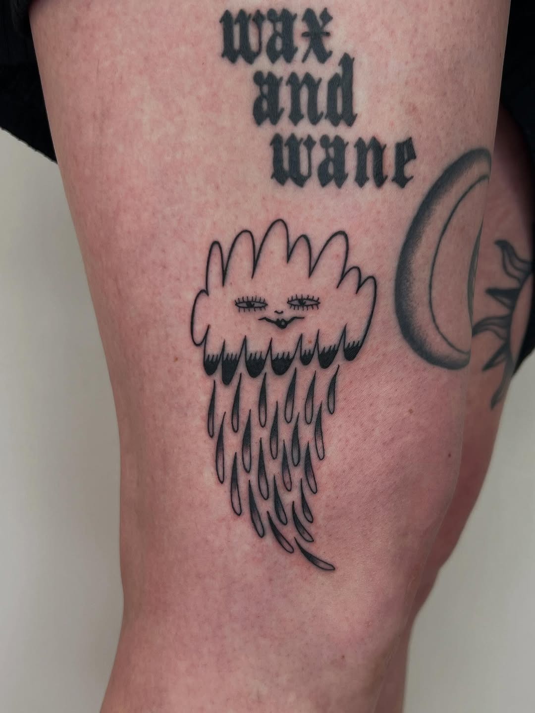 Whimsical cloud tattoo with playful raindrops Tattoo Design