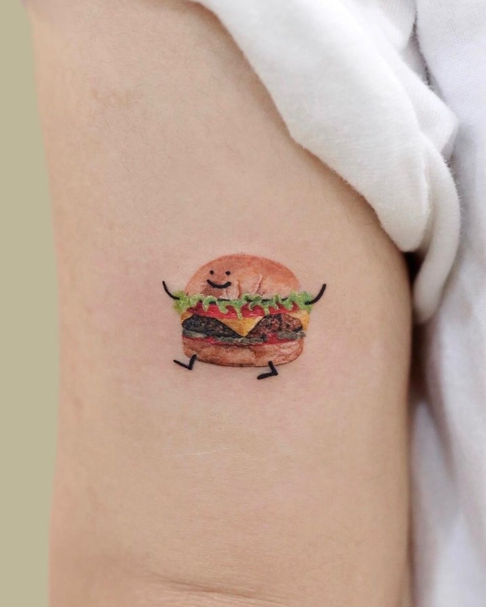 A playful burger tattoo with a cheerful vibe Tattoo Design