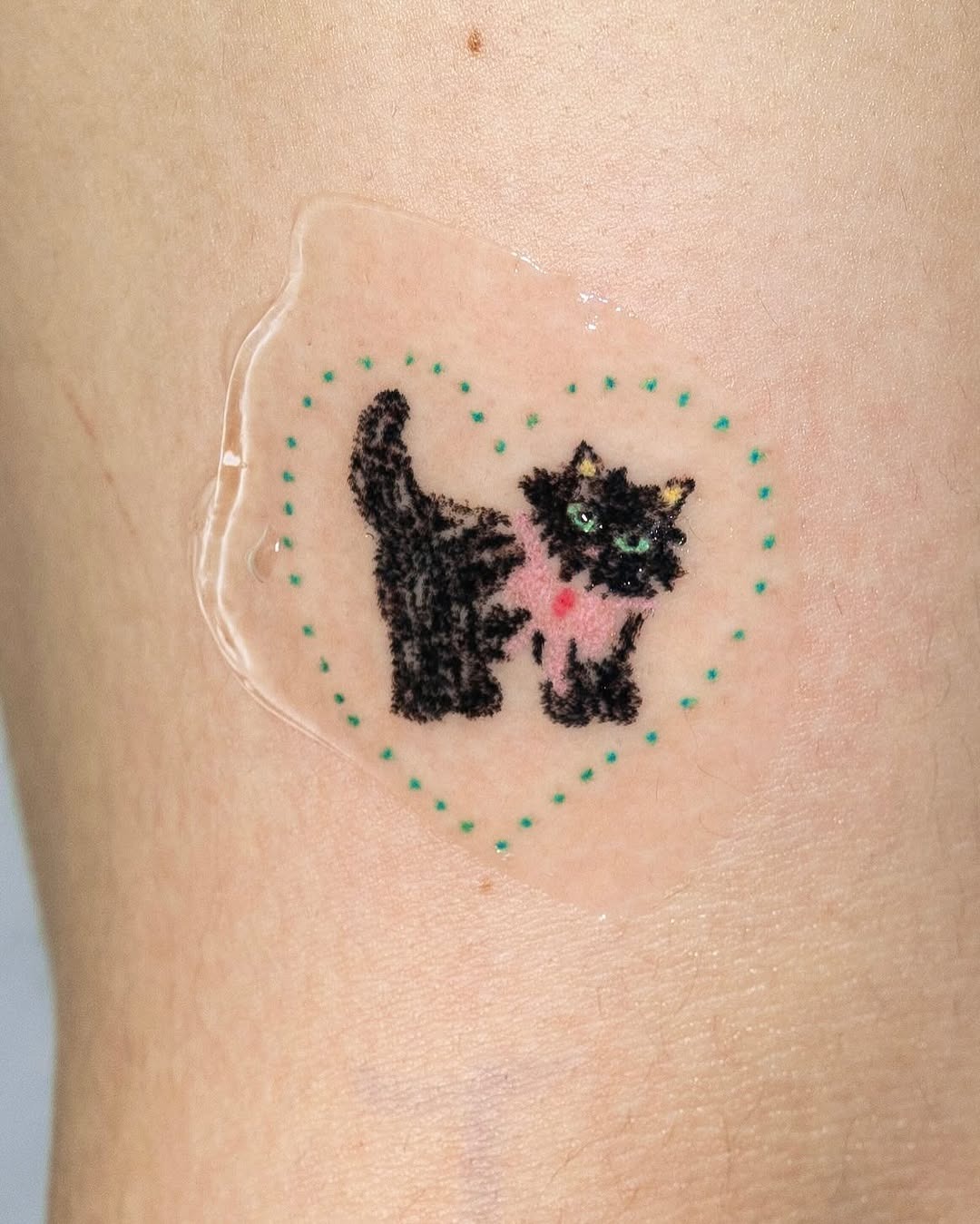 Adorable black cat tattoo with heart design Tattoo Design