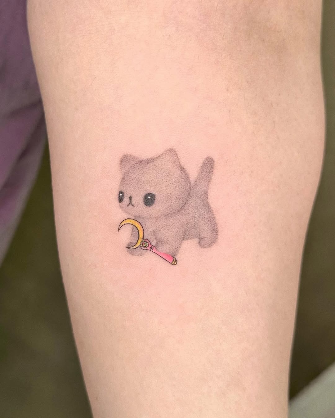 Adorable kitten tattoo with a playful twist Tattoo Design