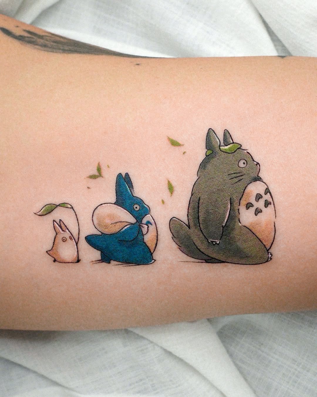 Adorable Totoro Characters in Whimsical Style Tattoo Design