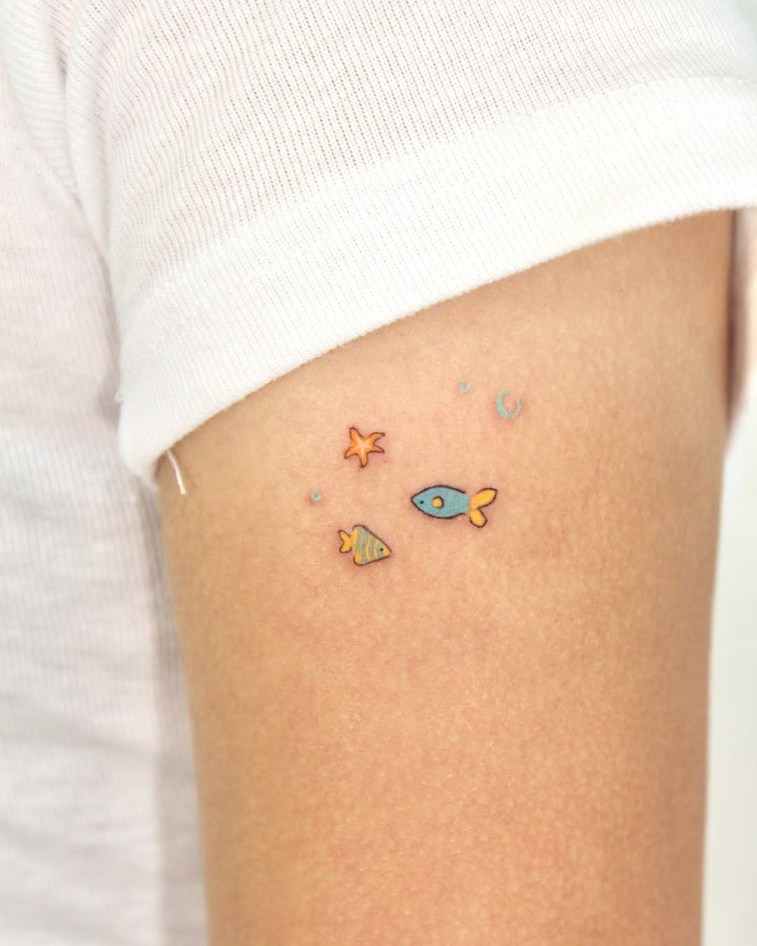 Adorable underwater-themed tattoo on arm Tattoo Design