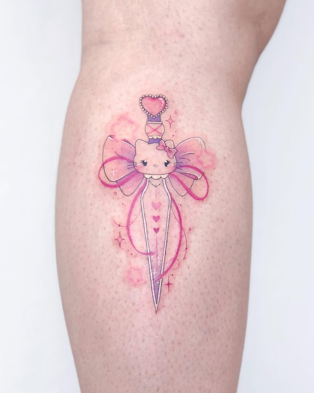 Charming fairy dagger tattoo with pink accents Tattoo Design