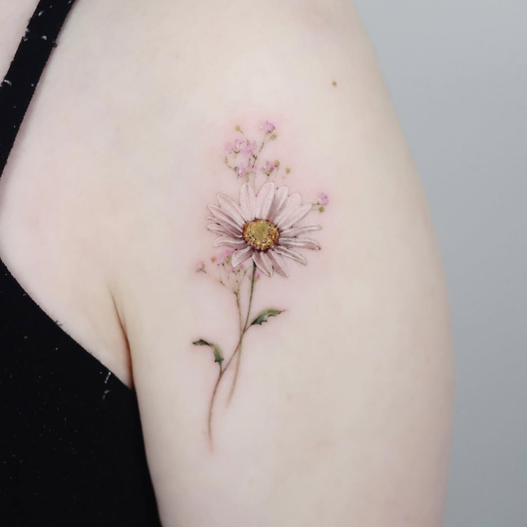 Delicate Pink Daisy Tattoo with Subtle Accents Tattoo Design