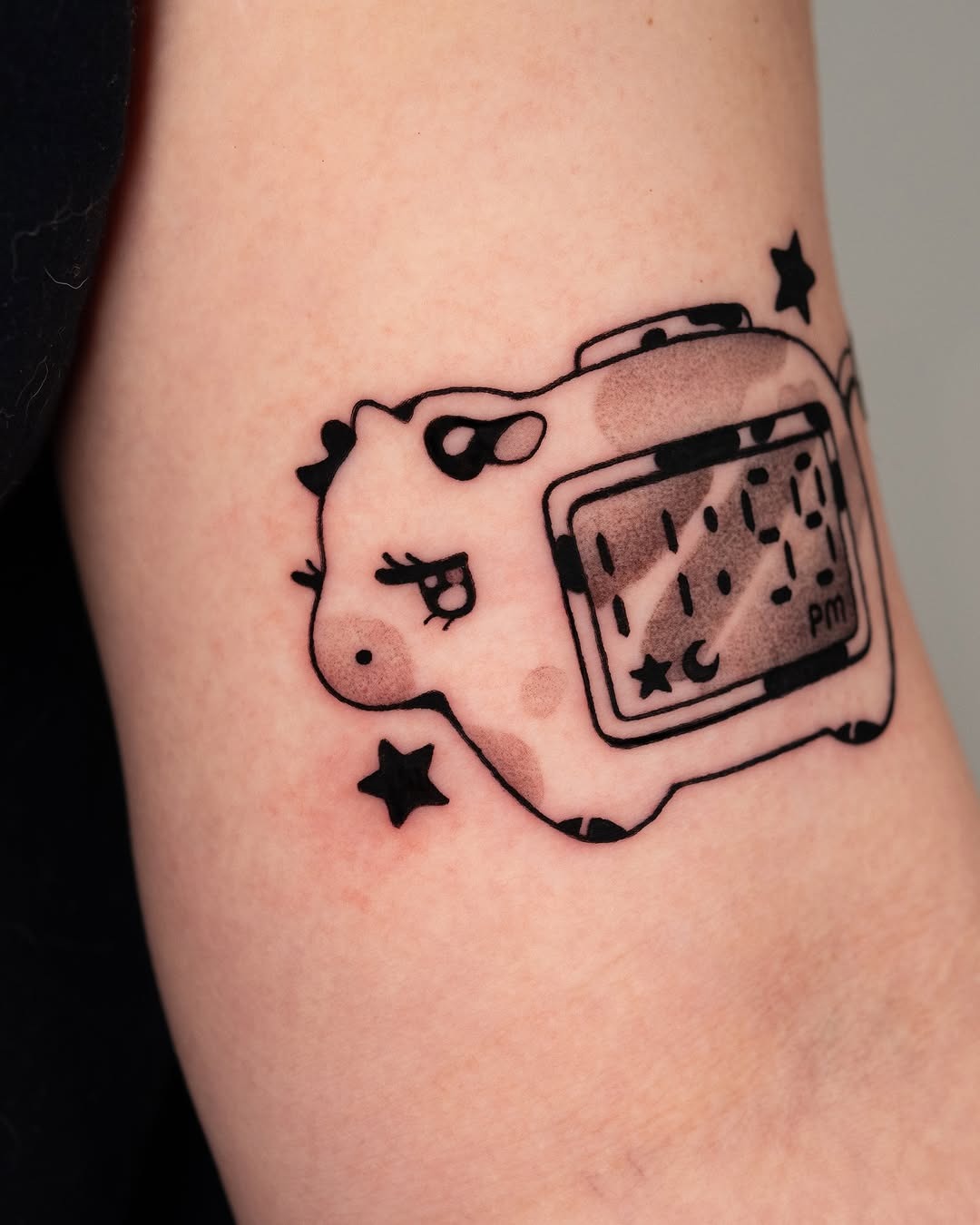 Whimsical Cow Tattoo with Camera Design Tattoo Design