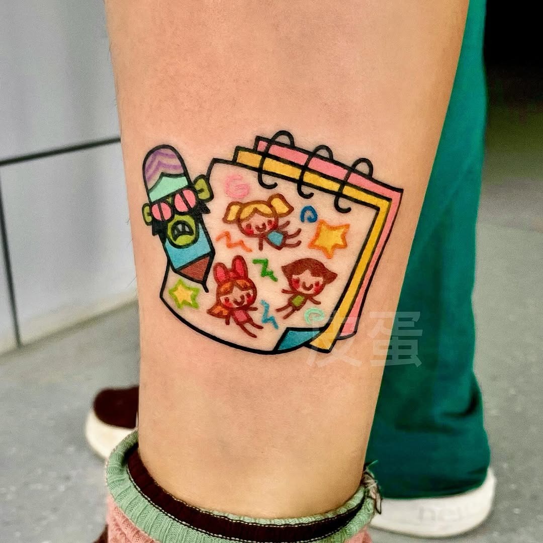 Whimsical notepad tattoo with playful characters Tattoo Design