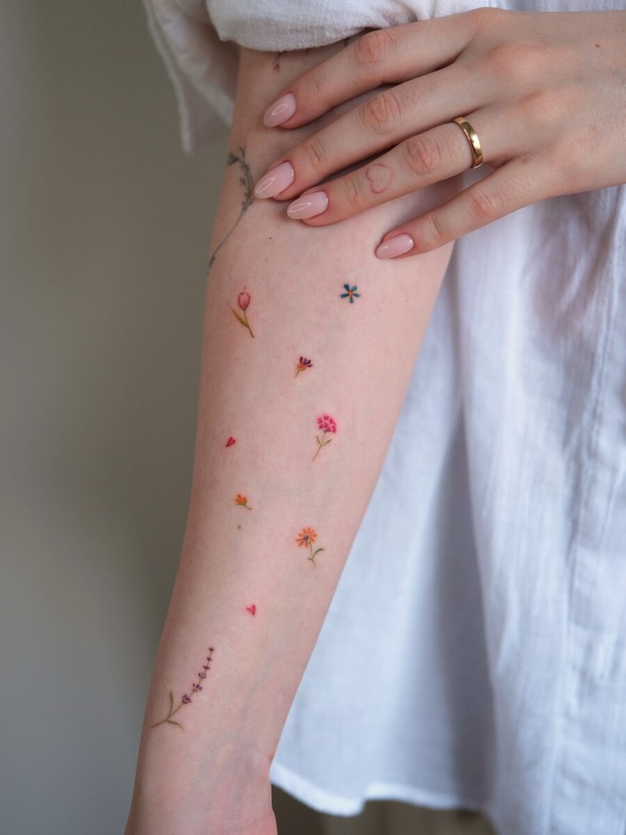 Charming Floral Dainty Tattoos on a Delicate Arm Tattoo Design