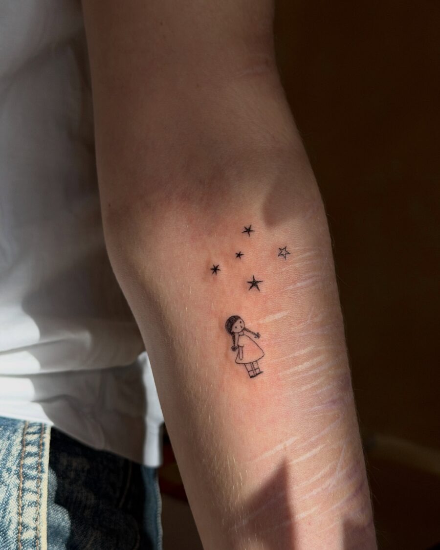 Charming Illustration of a Girl Among Stars Tattoo Design