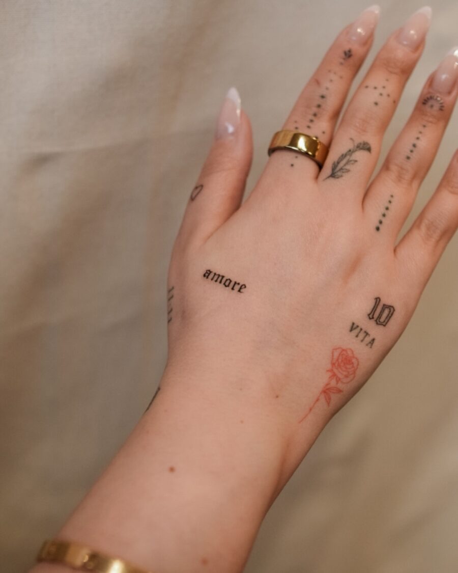Chic dainty tattoos accentuating delicate hands Tattoo Design