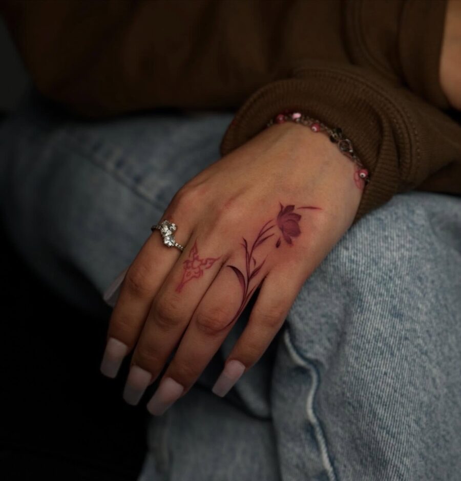 Delicate floral designs on hand tattoos Tattoo Design
